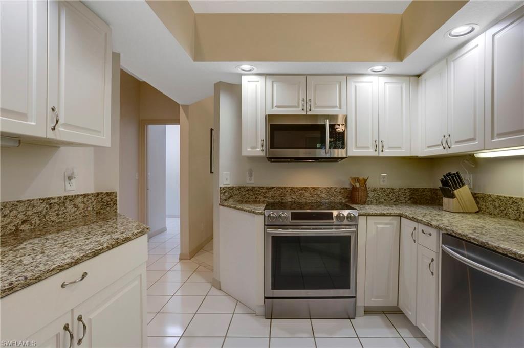 Kitchen features granite countertops and stainless steel appliances
