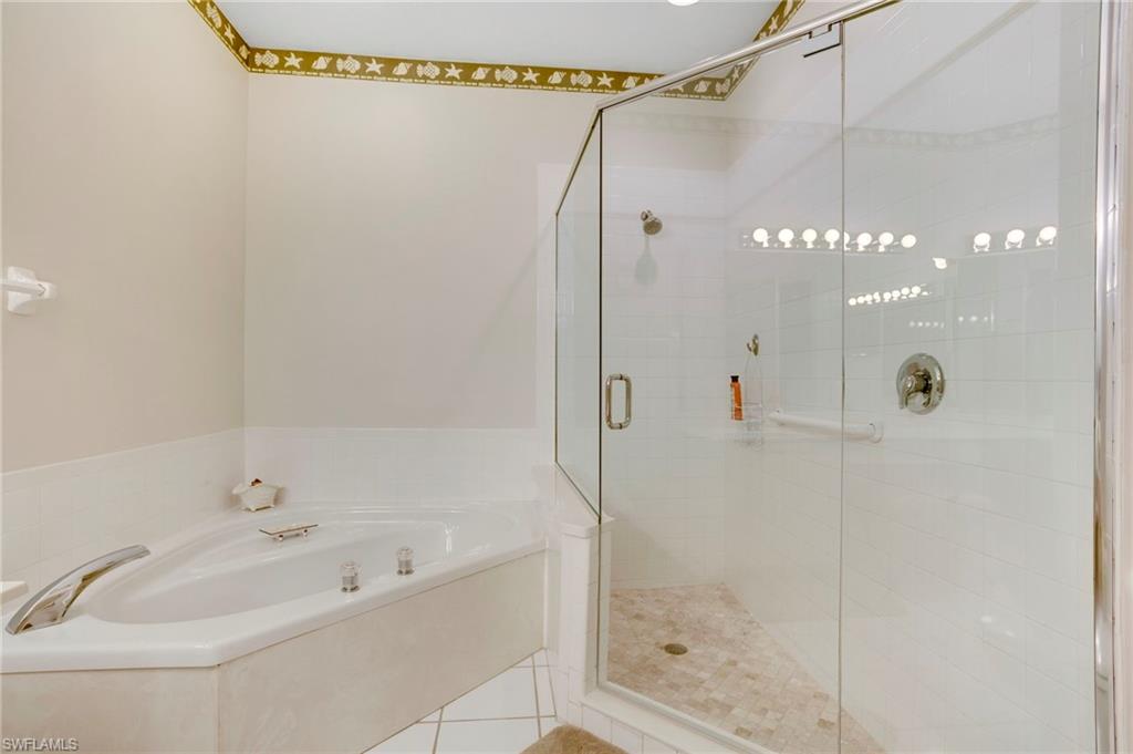 Primary bathroom has luxury soaking tub and separate roomy shower.