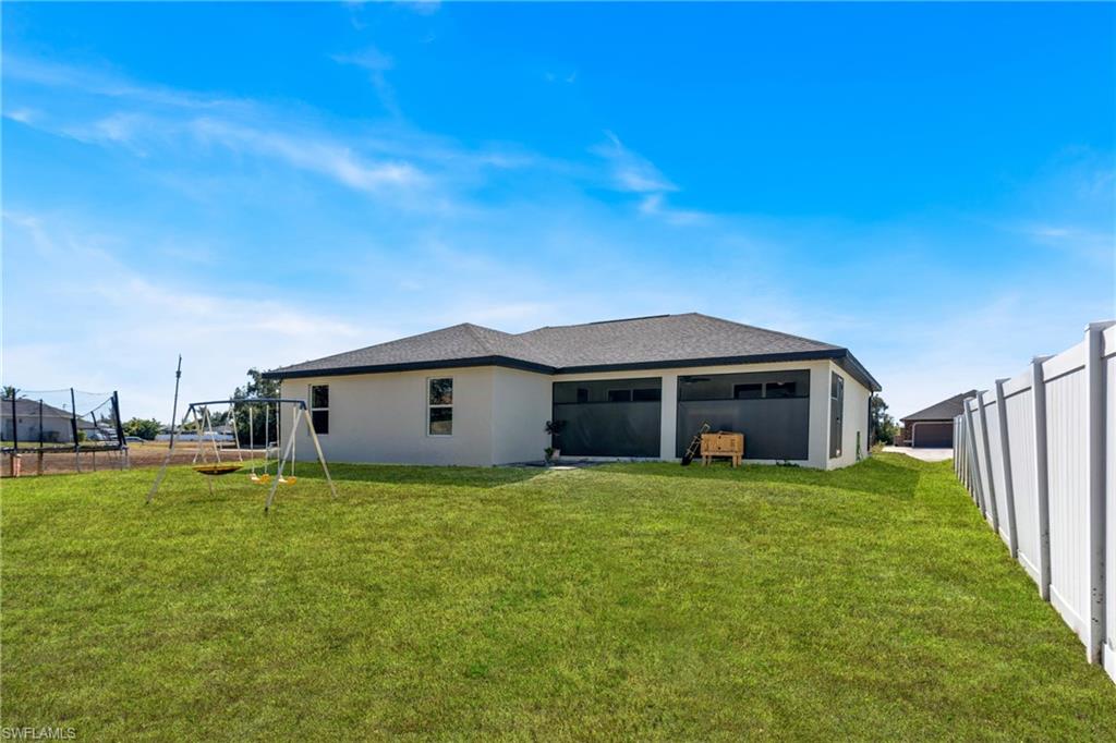 Back of property with stucco siding