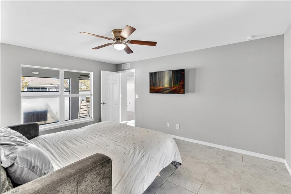 Bedroom featuring ceiling fan and light tile patterned floors