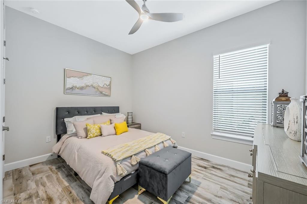 Bedroom with light wood-style flooring and ceiling fan
