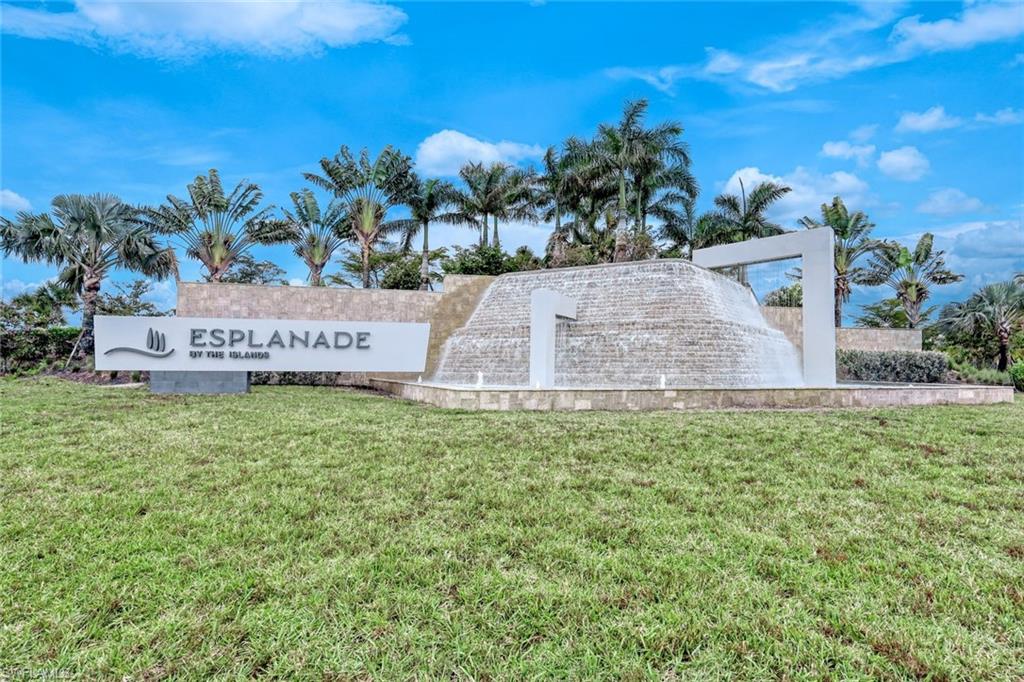 Community sign featuring a lawn