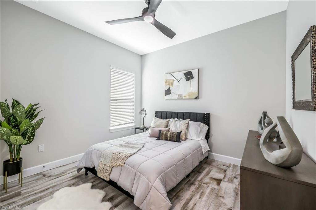 Bedroom featuring wood finished floors and ceiling fan