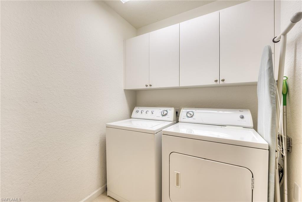 Laundry room next to garage entrance