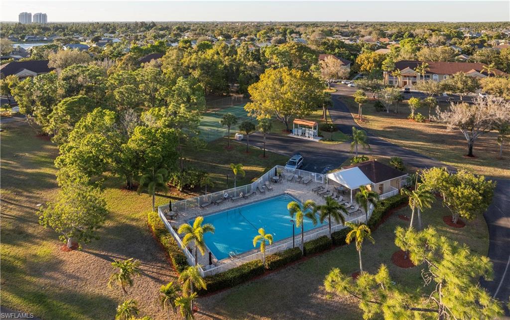 Aerial view of residential area featuring a pool