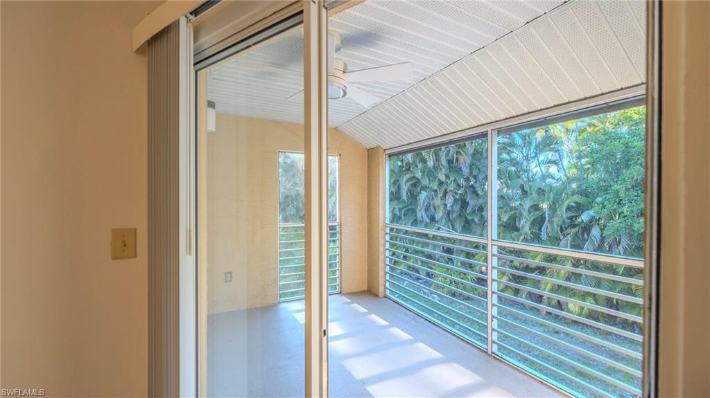 Unfurnished sunroom with lofted ceiling