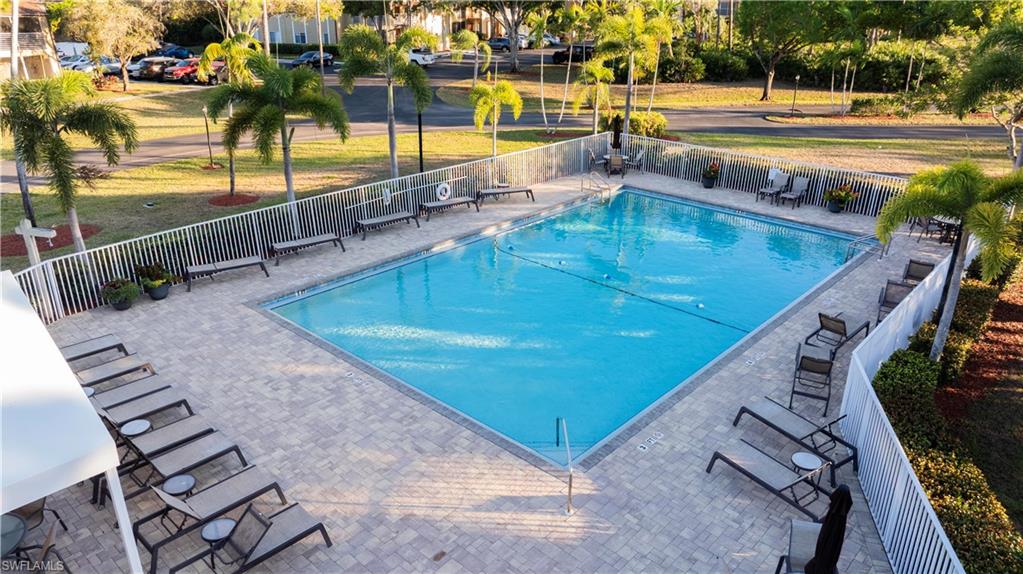 Community pool featuring a patio