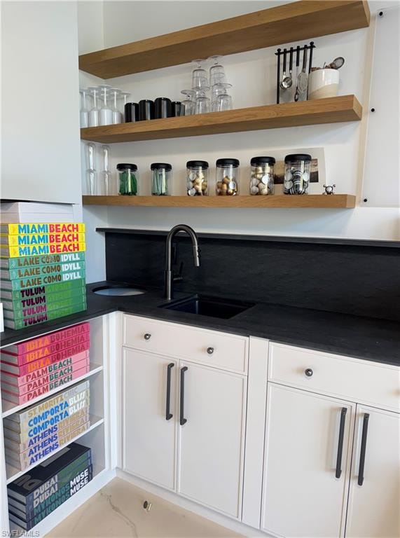 Pantry featuring a sink