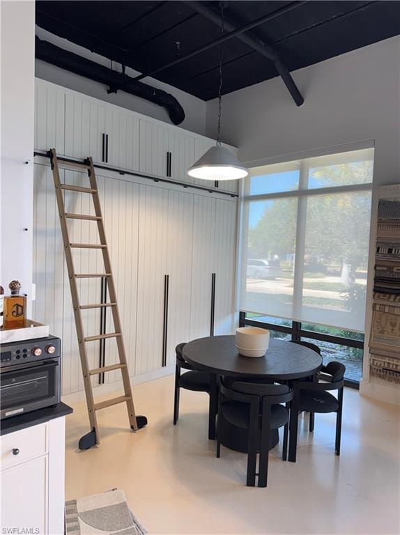 Dining area featuring concrete floors