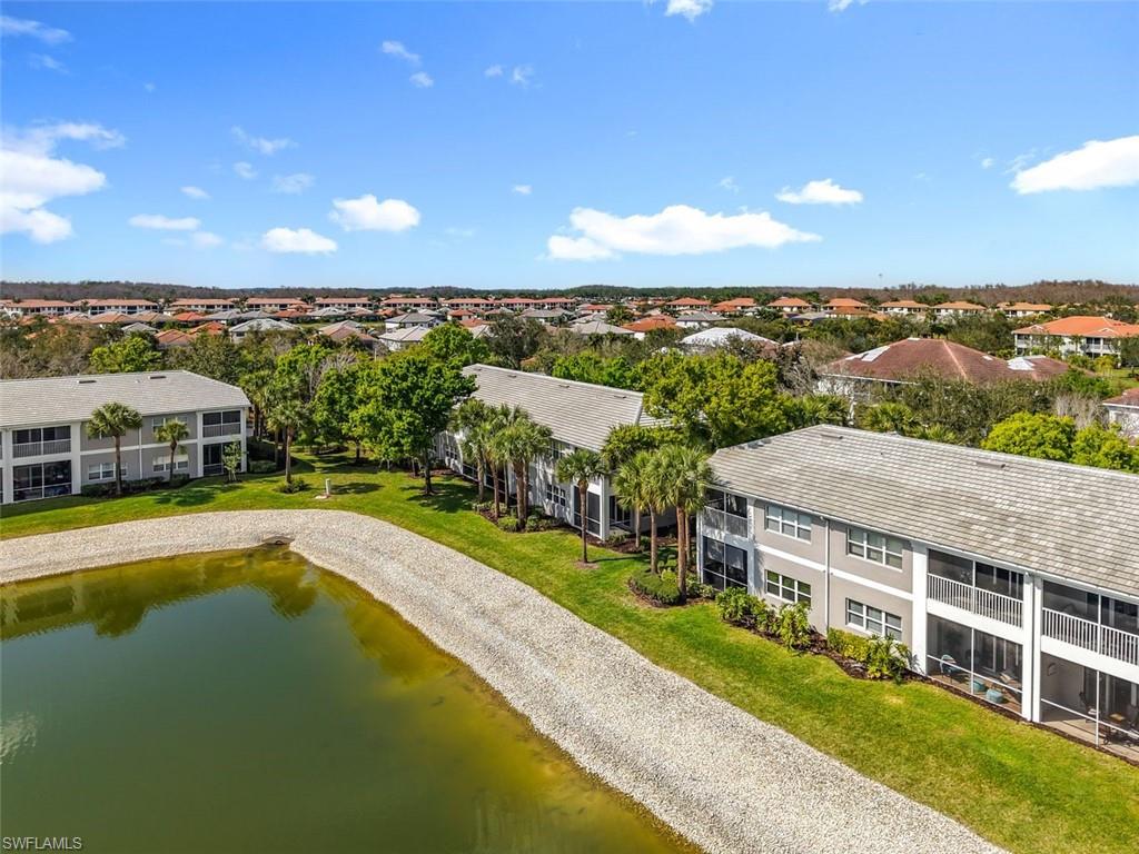Aerial view of a large body of water and apartment complex / building
