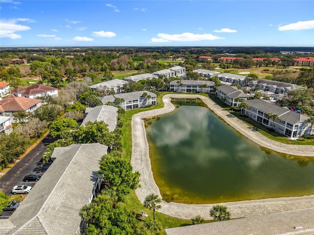 Aerial view of apartment complex and a large body of water