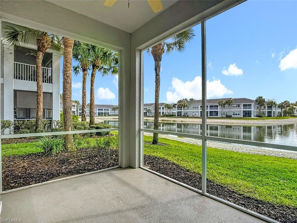 Unfurnished sunroom featuring ceiling fan and a water view