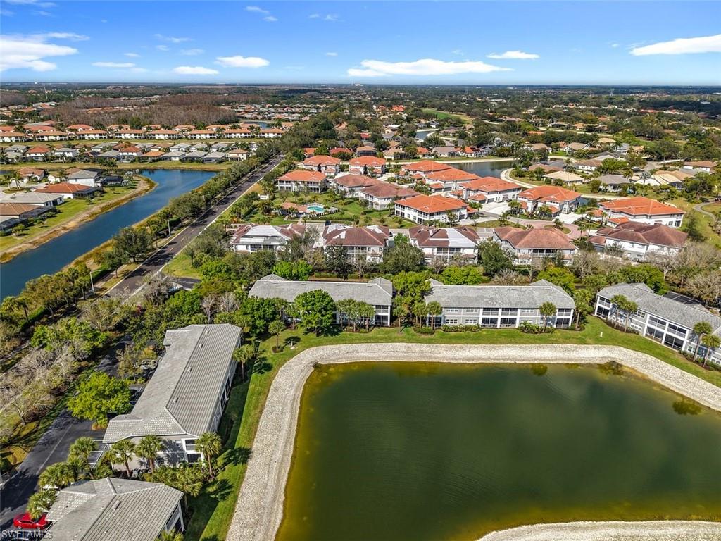 Aerial perspective of suburban area with a nearby body of water