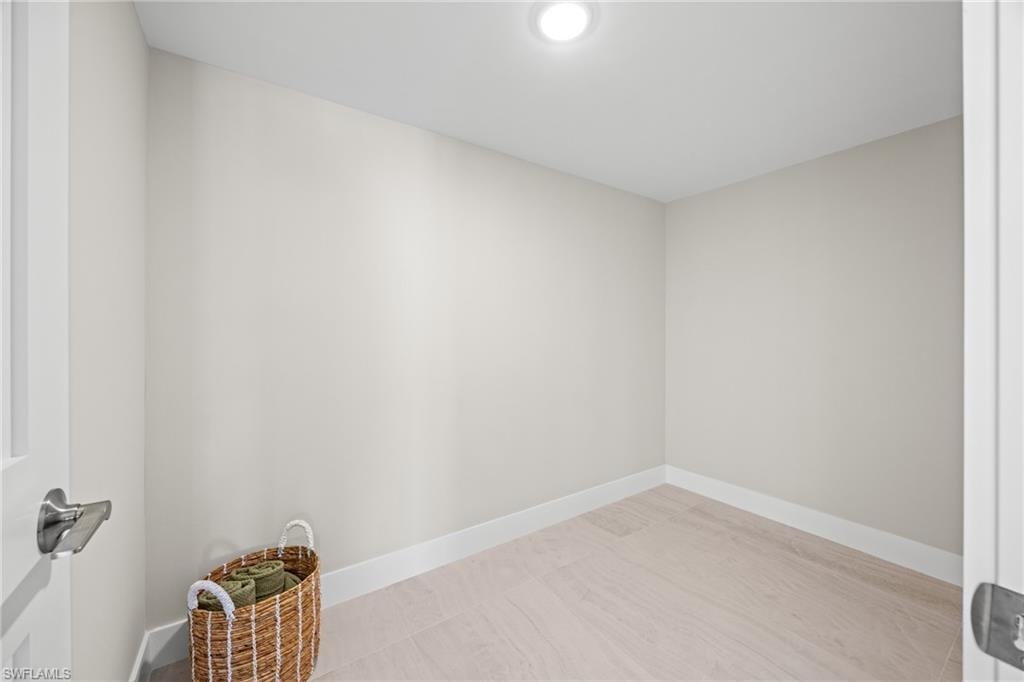 Empty room featuring baseboards