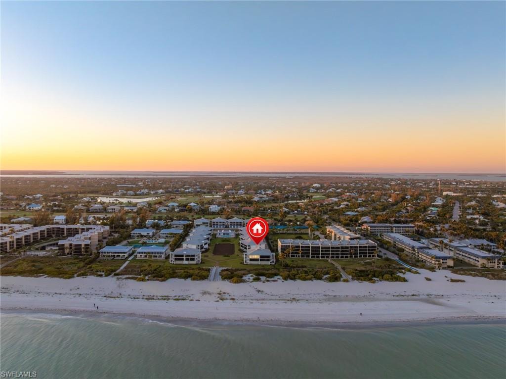 Aerial view at dusk of view of water and beach