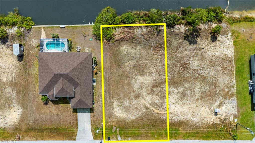 View of property location with property parcel outlined and a pool area