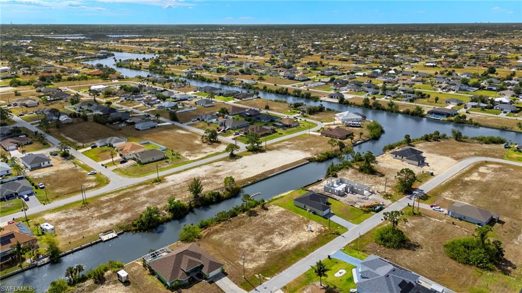 Aerial view of residential area with a nearby body of water