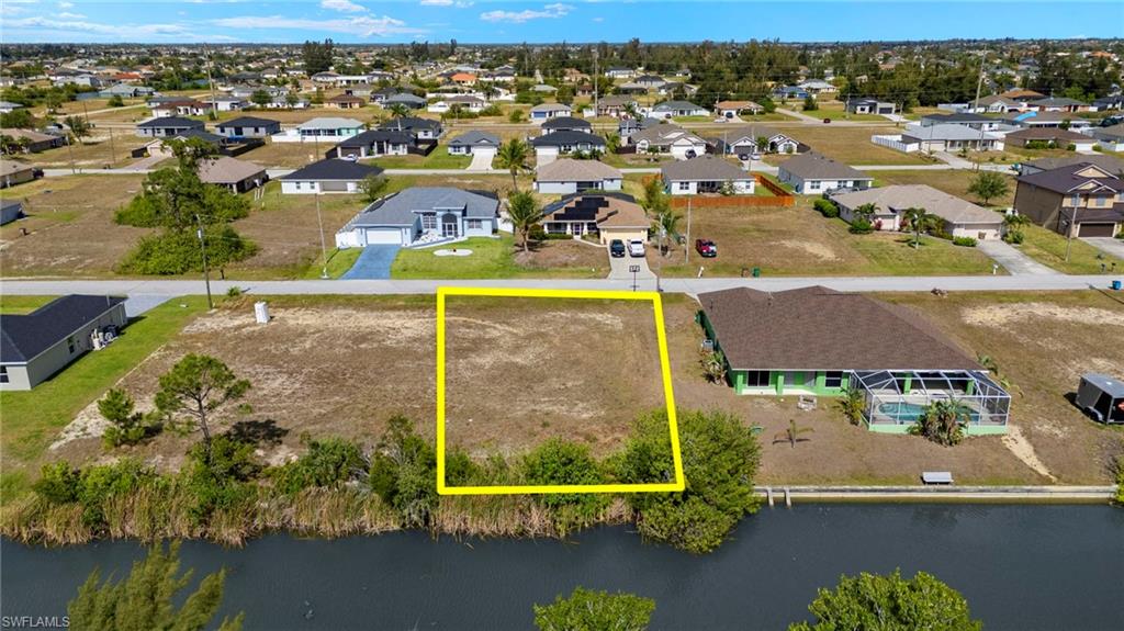Aerial view of residential area with property parcel outlined