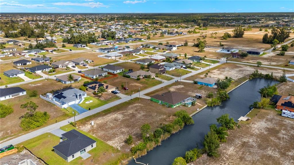 Aerial view of residential area with a nearby body of water