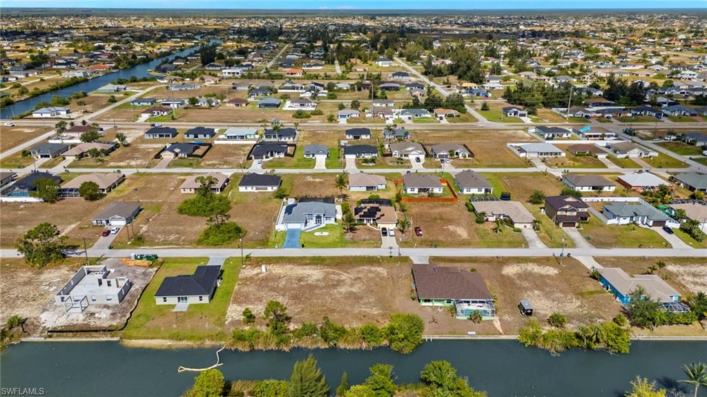 View of property location featuring nearby suburban area and a nearby body of water