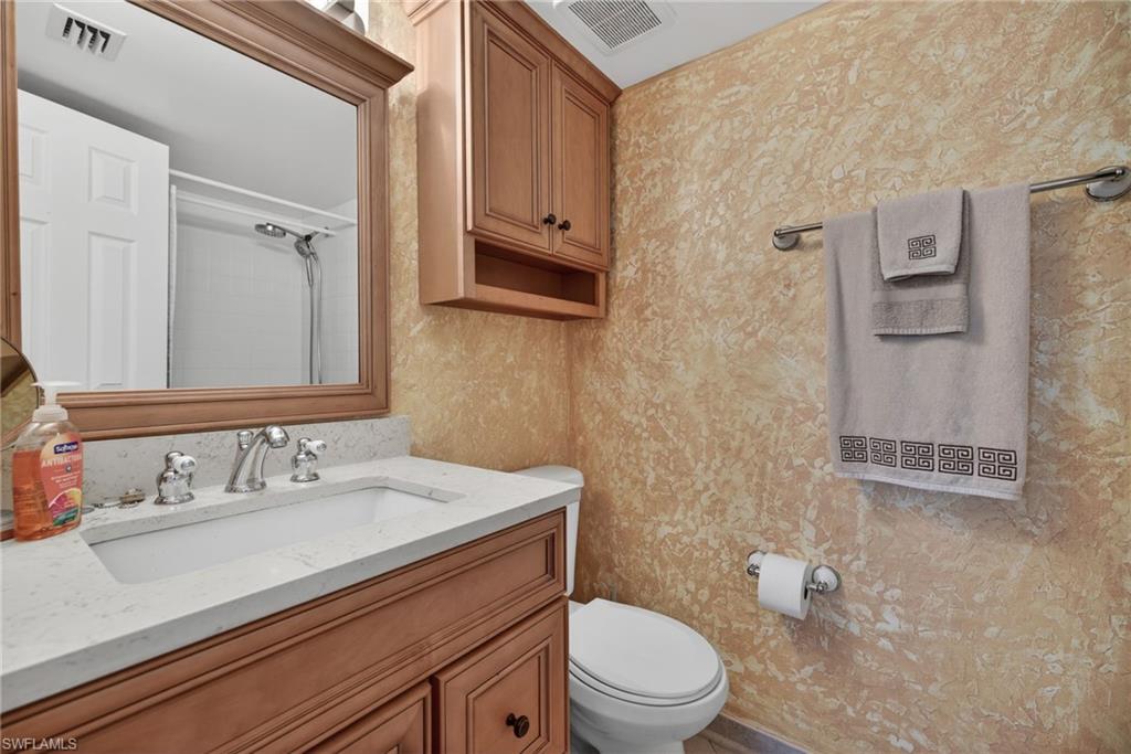 Full bathroom with vanity and a shower