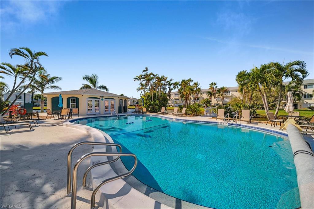 Community pool featuring a patio
