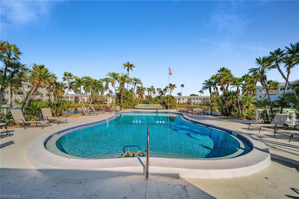 Community pool with a patio area