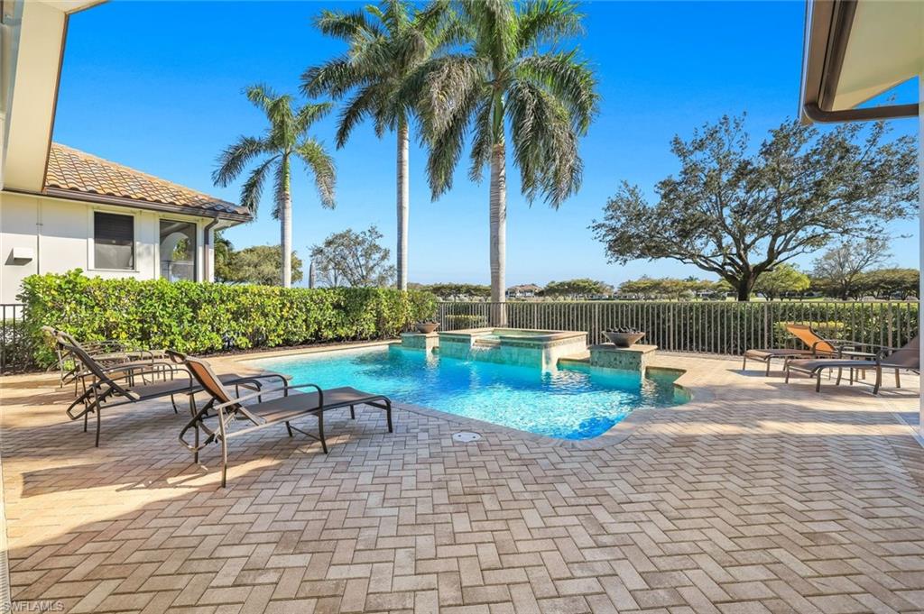 Combined pool / hot tub featuring a patio area