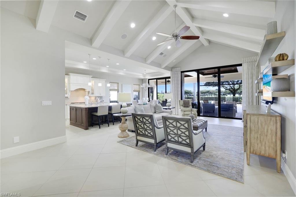 Living area with recessed lighting, a ceiling fan, and light tile patterned floors