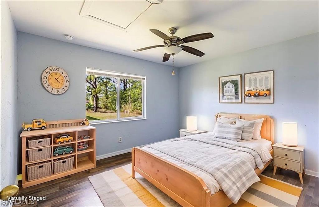 Bedroom featuring wood finished floors and a ceiling fan