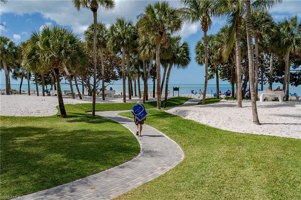 View of community featuring volleyball court and a water view