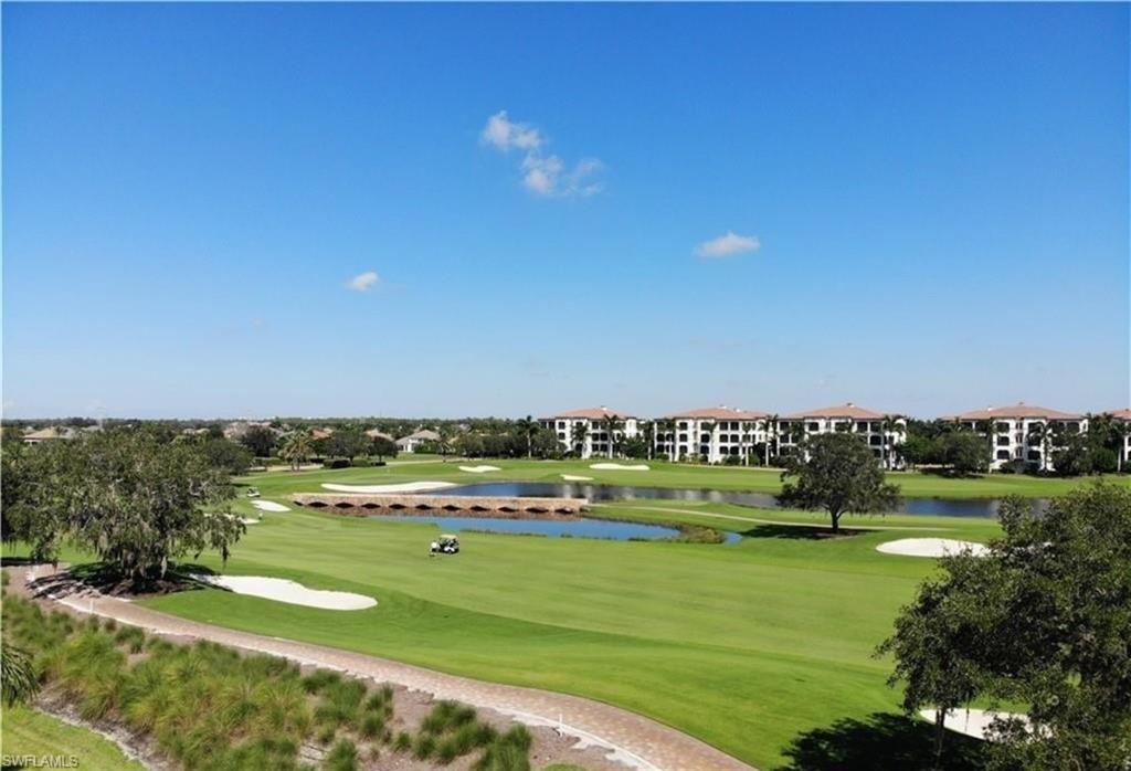 View of community featuring view of golf course and a water view