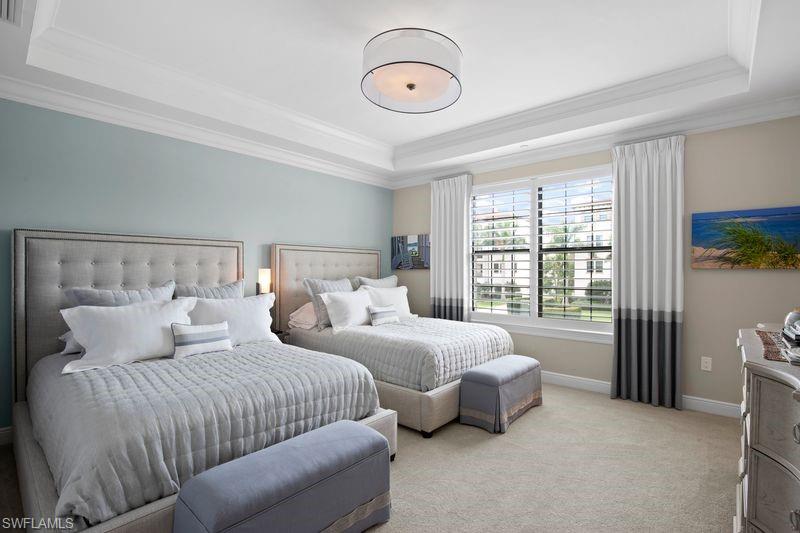 Bedroom featuring carpet floors and crown molding