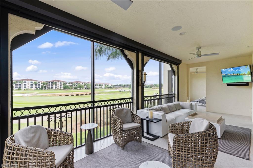 Sunroom / solarium featuring an outdoor lounge area, ceiling fan, and a balcony