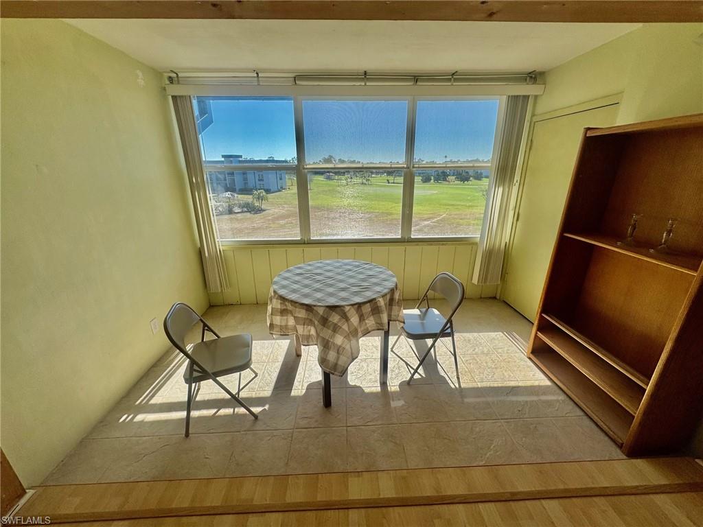 Dining space featuring plenty of natural light and light tile patterned floors