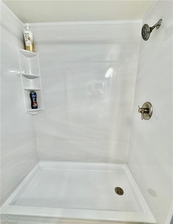 Full bath featuring a shower stall