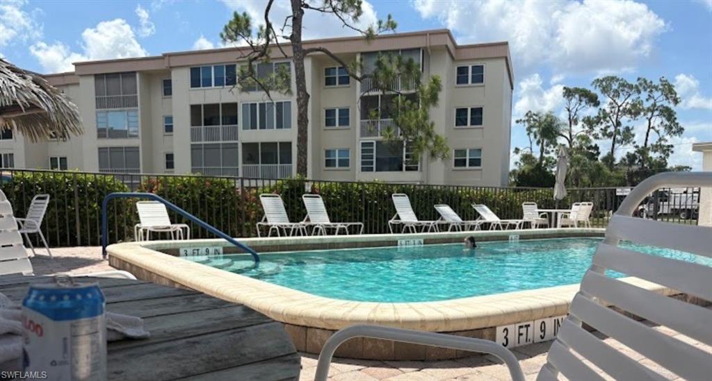 Community pool featuring a patio