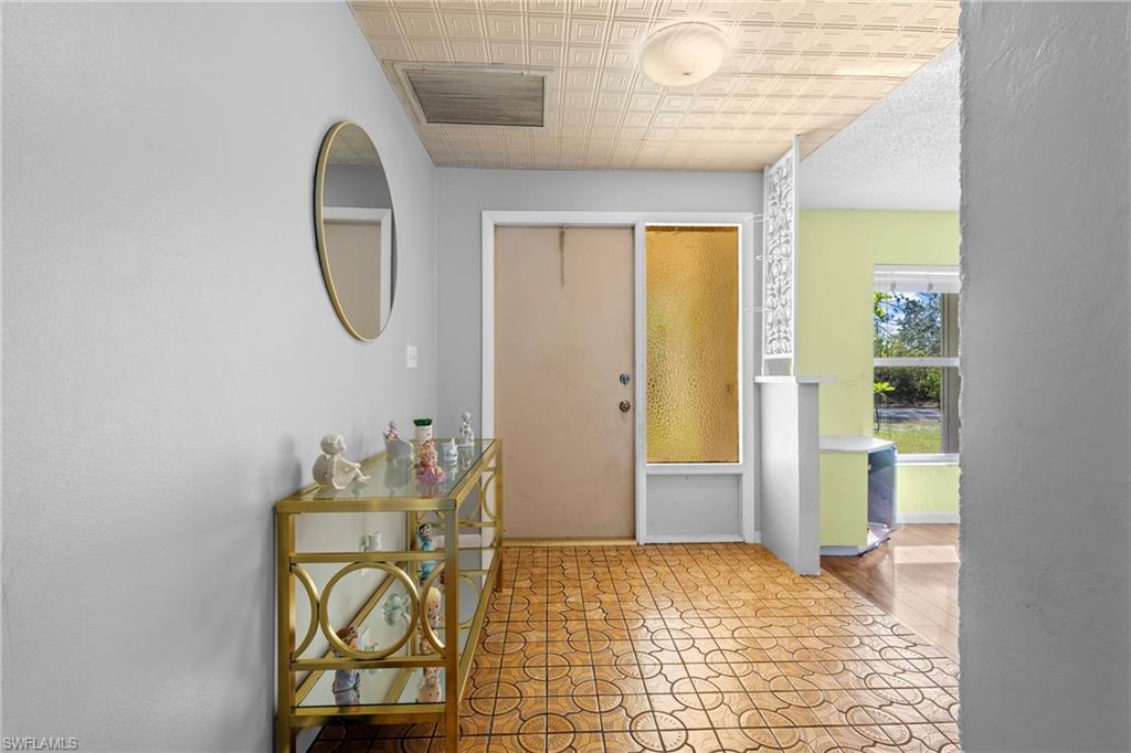 Foyer featuring an ornate ceiling