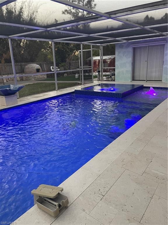 Integrated pool / spa featuring glass enclosure and a sunroom