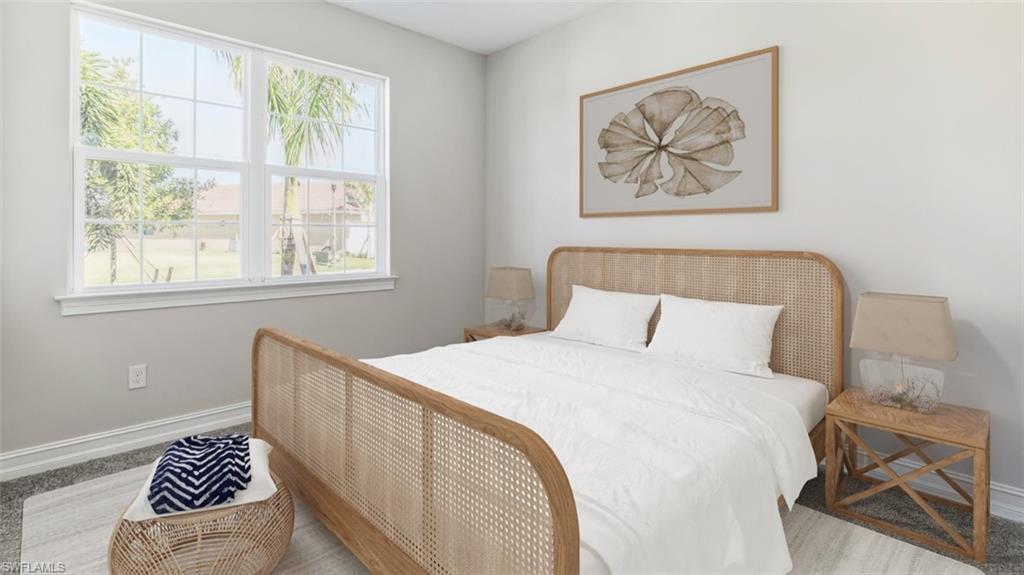 This image is virtually staged. Bedroom featuring baseboards and carpet