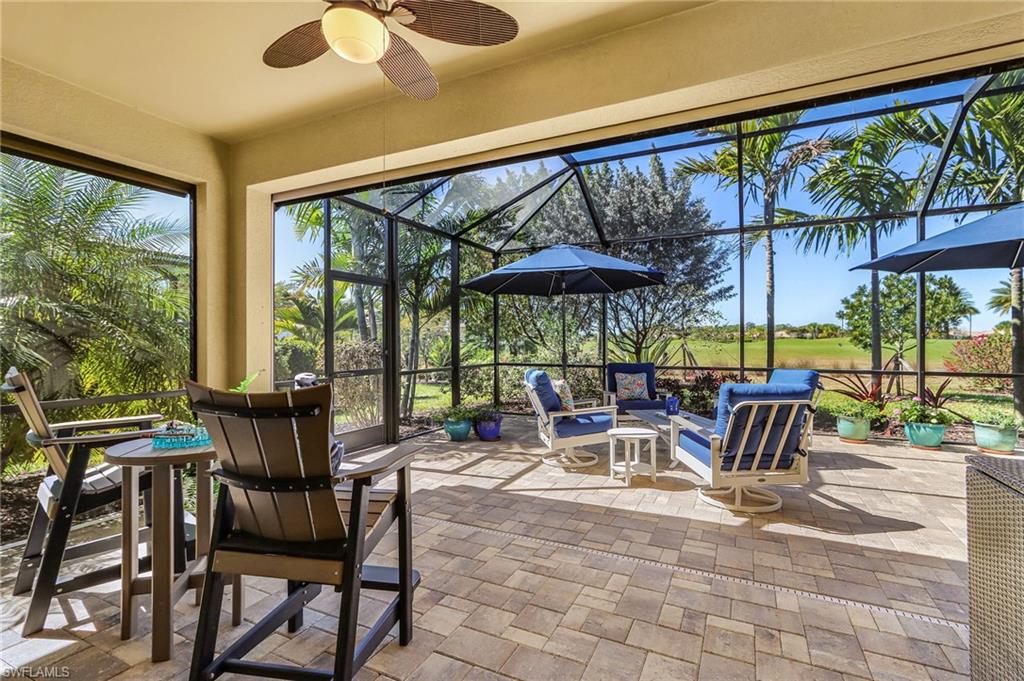 Sunroom with a patio area, a ceiling fan, golf course view, and an outdoor hangout area