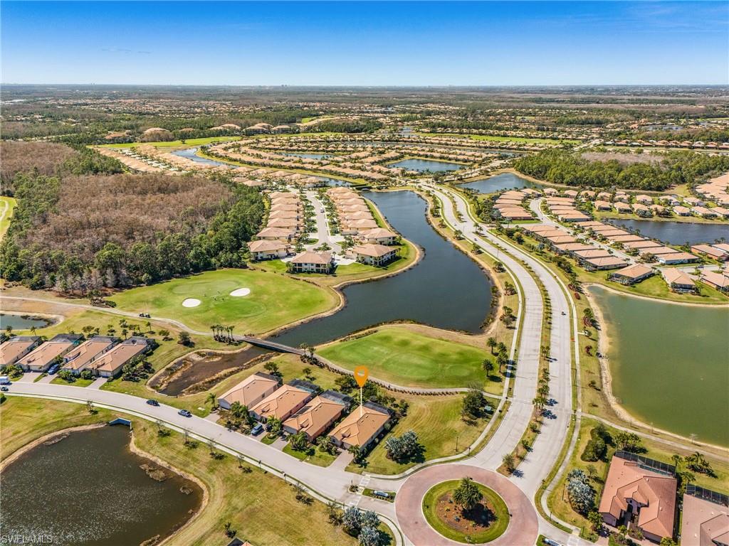 Aerial view of property's location featuring nearby suburban area and a nearby body of water