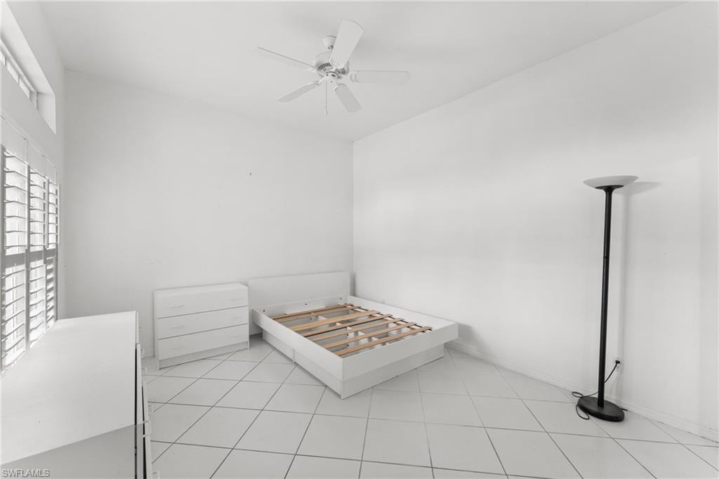 Unfurnished bedroom featuring a ceiling fan