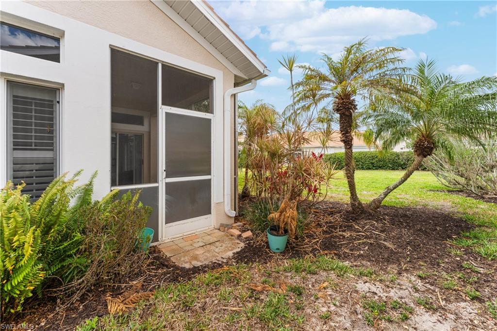View of yard with a sunroom