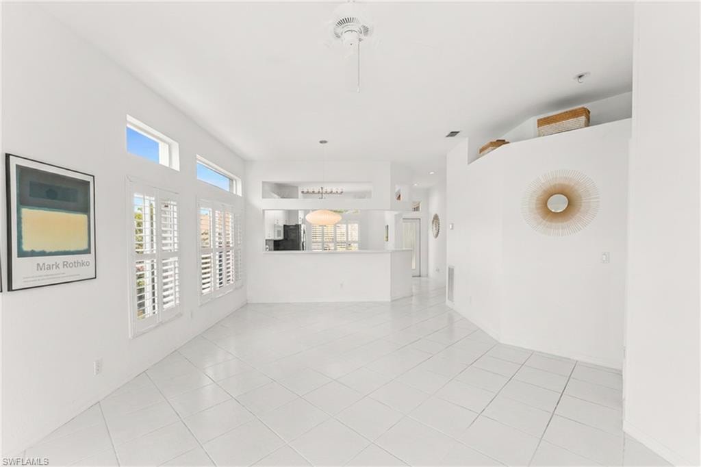 Unfurnished living room featuring light tile patterned flooring