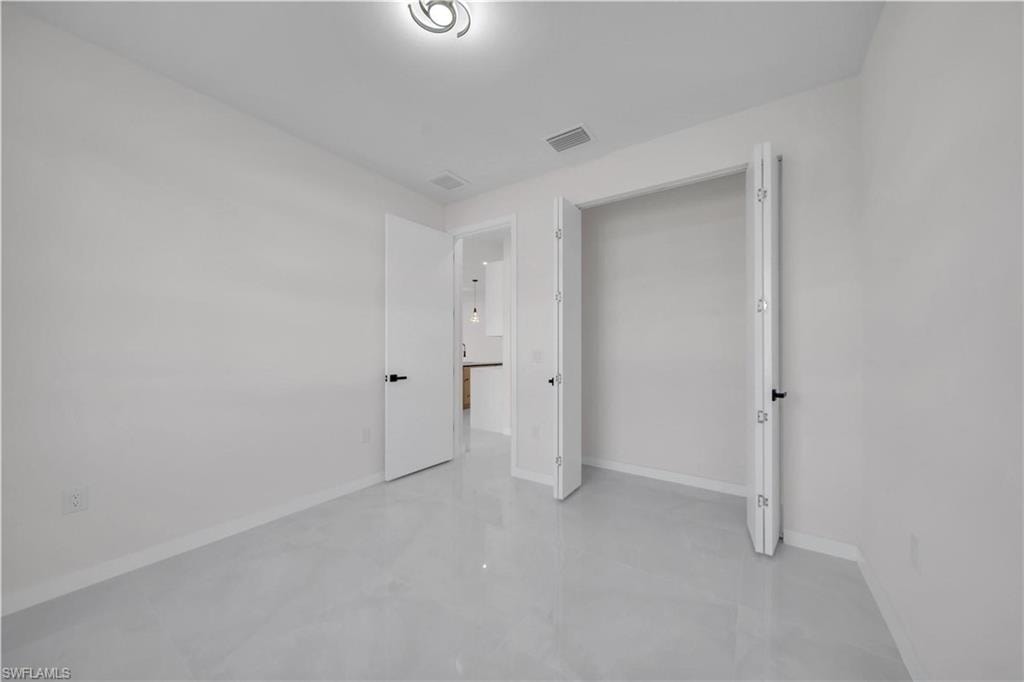 Unfurnished bedroom featuring baseboards
