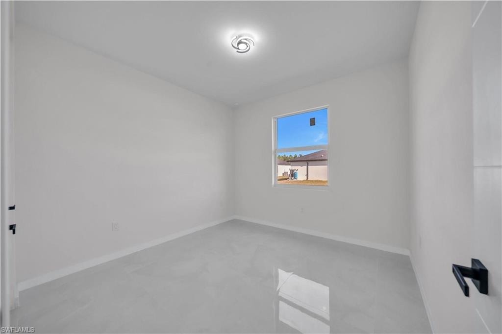 Empty room with baseboards