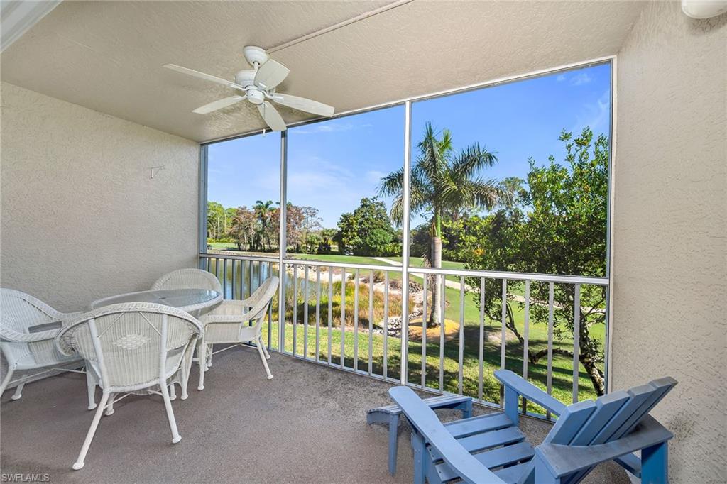Sunroom featuring a ceiling fan and a balcony