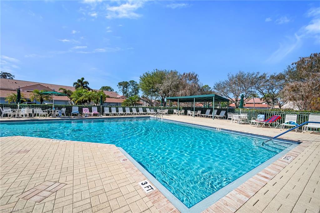 Community pool featuring a patio