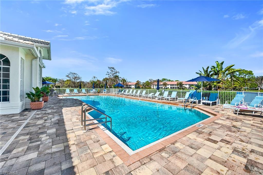 Community pool with a patio